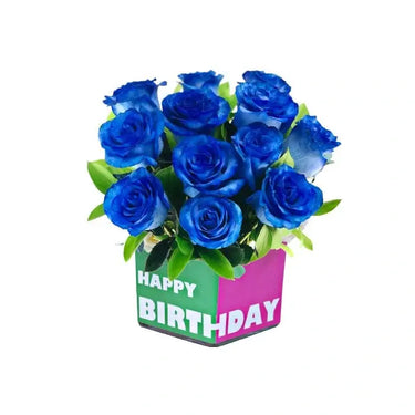 Smashing Birthday Joy, Vibrant Flowers Arrangement, Blue Tinted Roses, Green Ruscus Leaves, Square Glass Vase
